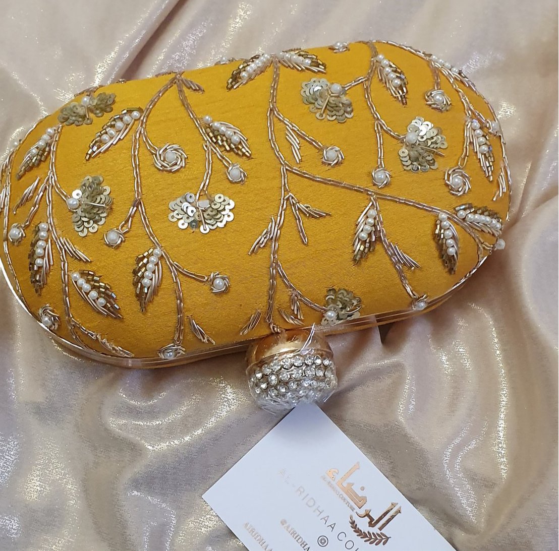 Small Oval Embroidered Clutch