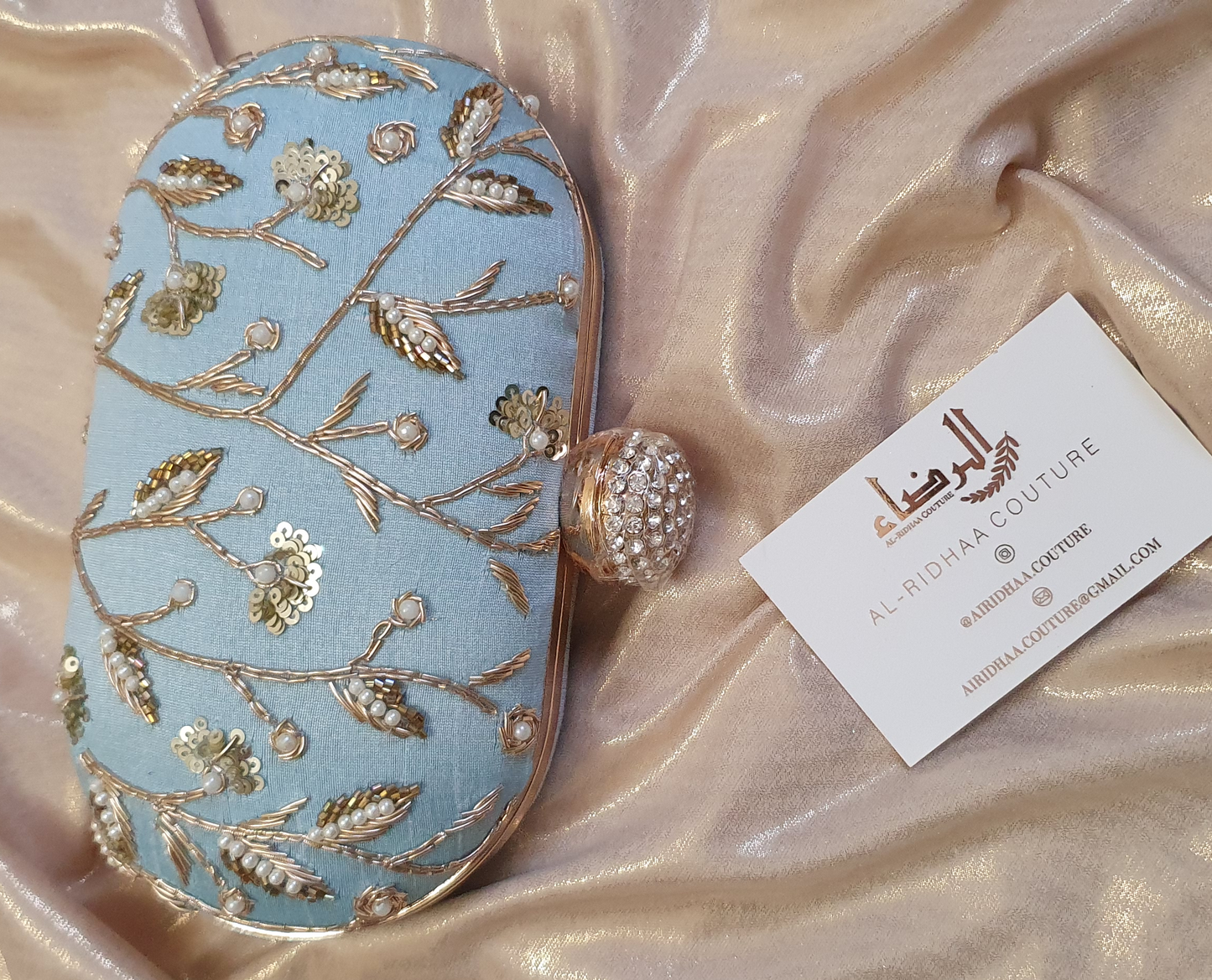 Small Oval Embroidered Clutch