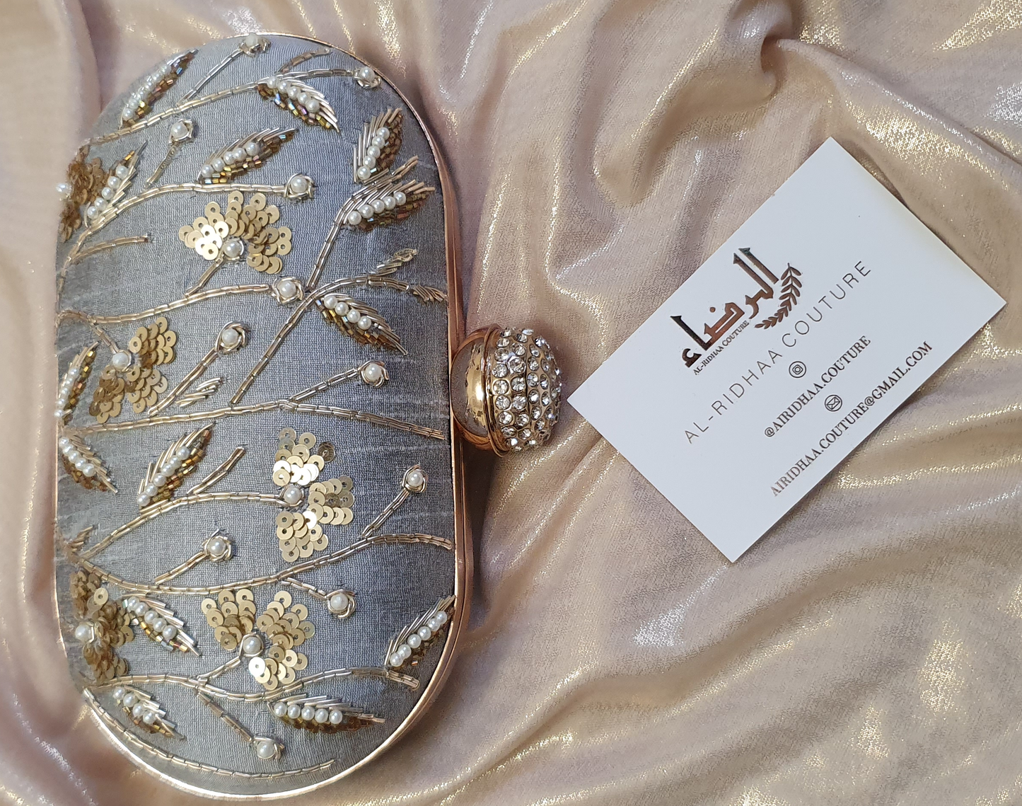 Small Oval Embroidered Clutch