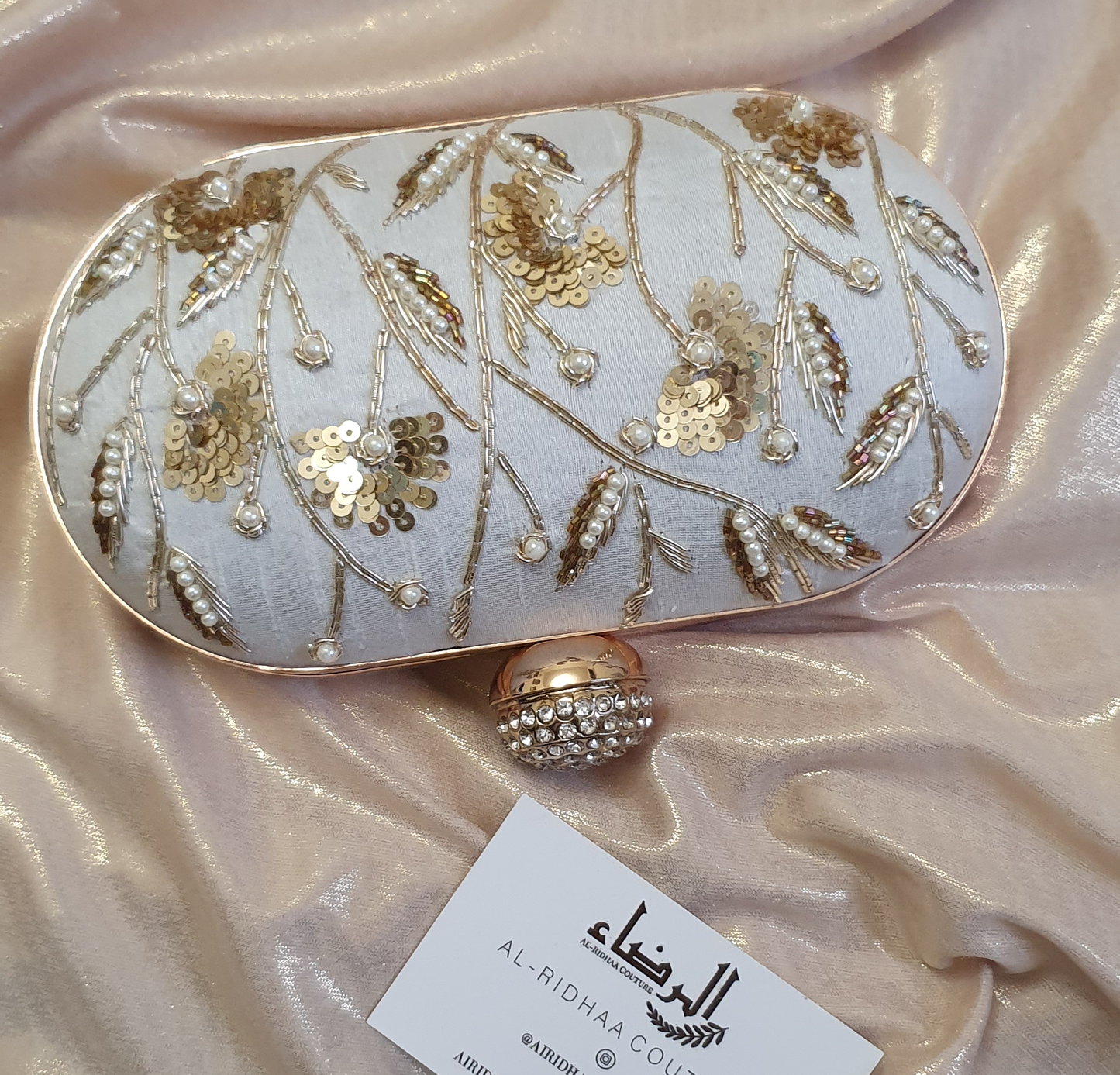 Small Oval Embroidered Clutch